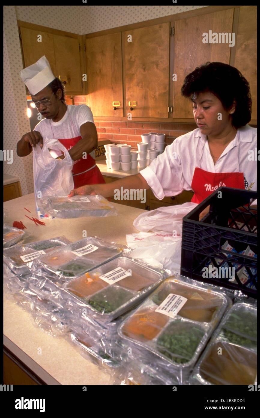 Austin, Texas USA, circa 1989 Meals on Wheels volunteers pack up