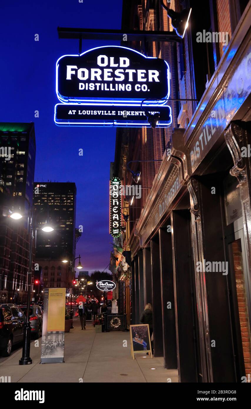 The night view of Whiskey Row and downtown of Louisville with the neon sign  of Old Forester Distilling Co in foreground.Kentucky.USA Stock Photo - Alamy