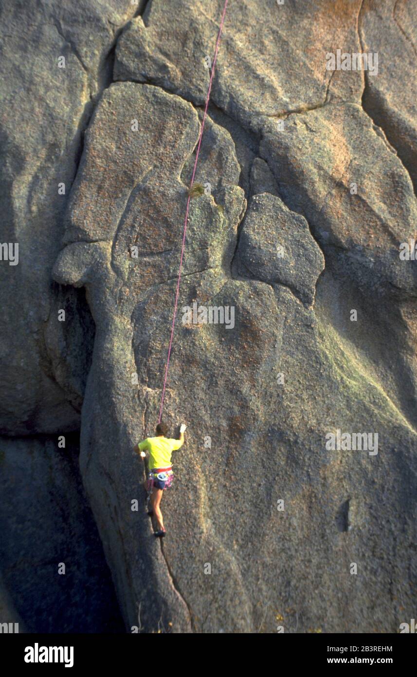 Enchanted Rock State Park, Texas USA: Rock climber follows crevice up technical route on a granite cliff. ©Bob Daemmrich Stock Photo