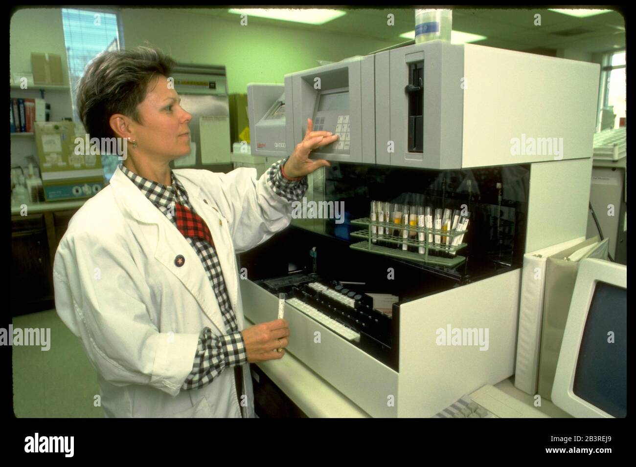 Austin Texas USA: Female immunologist working in a laboratory. ©Bob Daemmrich Stock Photo
