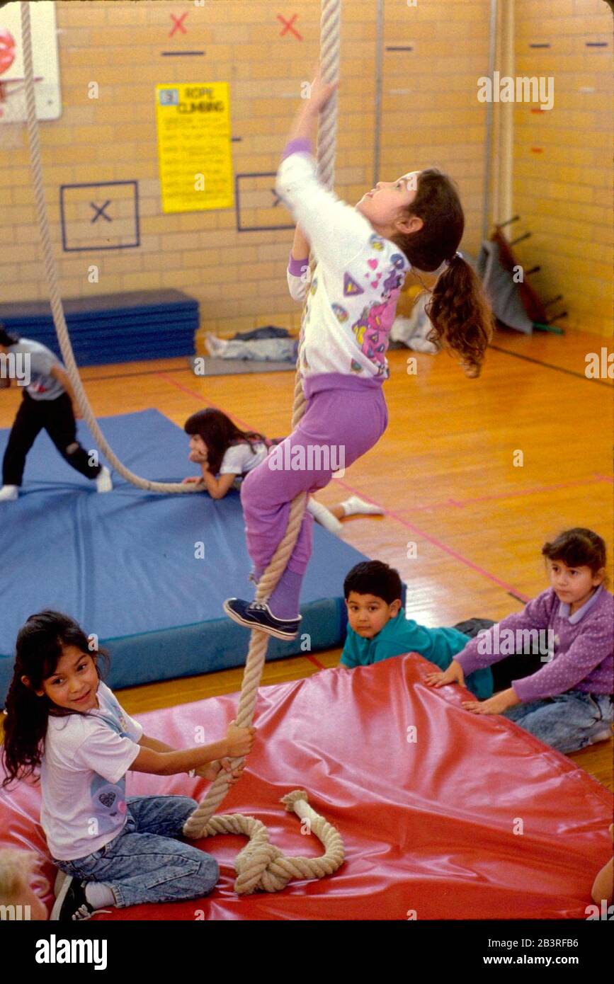 Austin, Texas USA, circa 1989 Rope climbing in kindergarten physical
