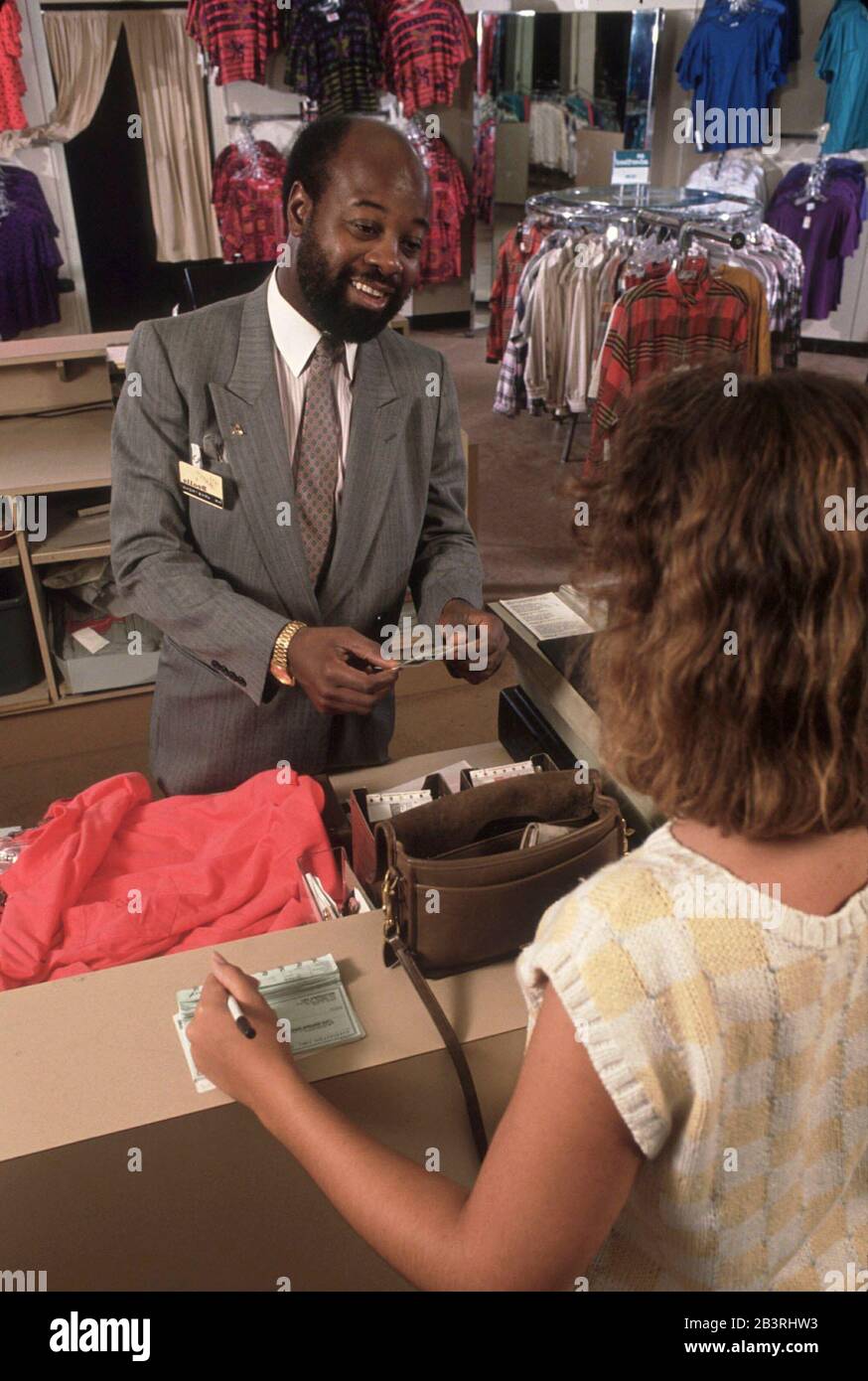 Department Store Clerk High Resolution Stock Photography and Images - Alamy