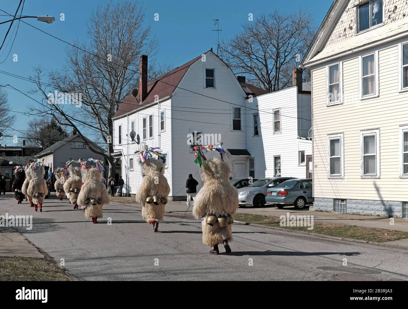 Kurents parade down Lausche Avenue in Cleveland, Ohio, USA during the end of winter 2020 Cleveland Kurentovanje Cultural Festival. Stock Photo