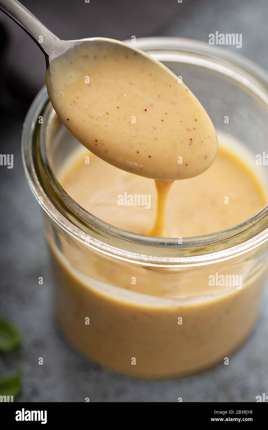 Homemade creamy honey mustard sauce in a glass jar Stock Photo Alamy