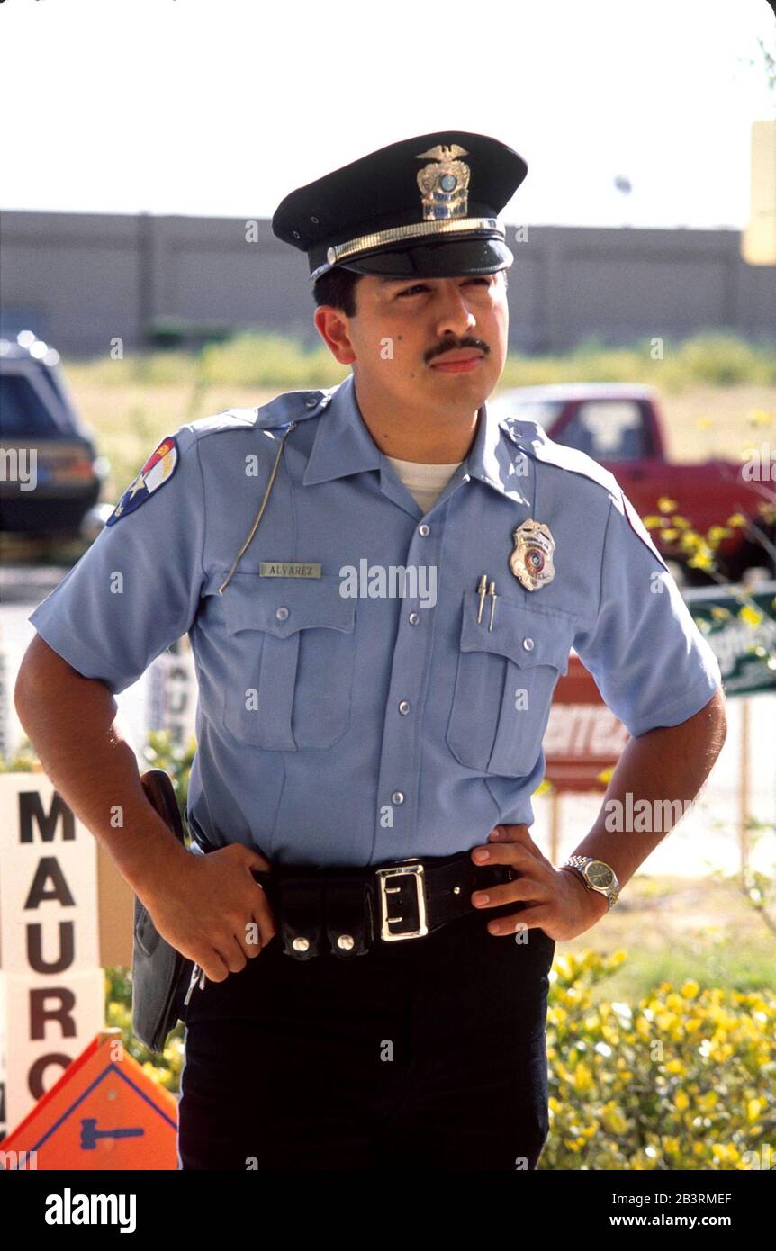 Edinburg, Texas USA: Hispanic police officer on duty in South Texas. ©Bob  Daemmrich Stock Photo - Alamy