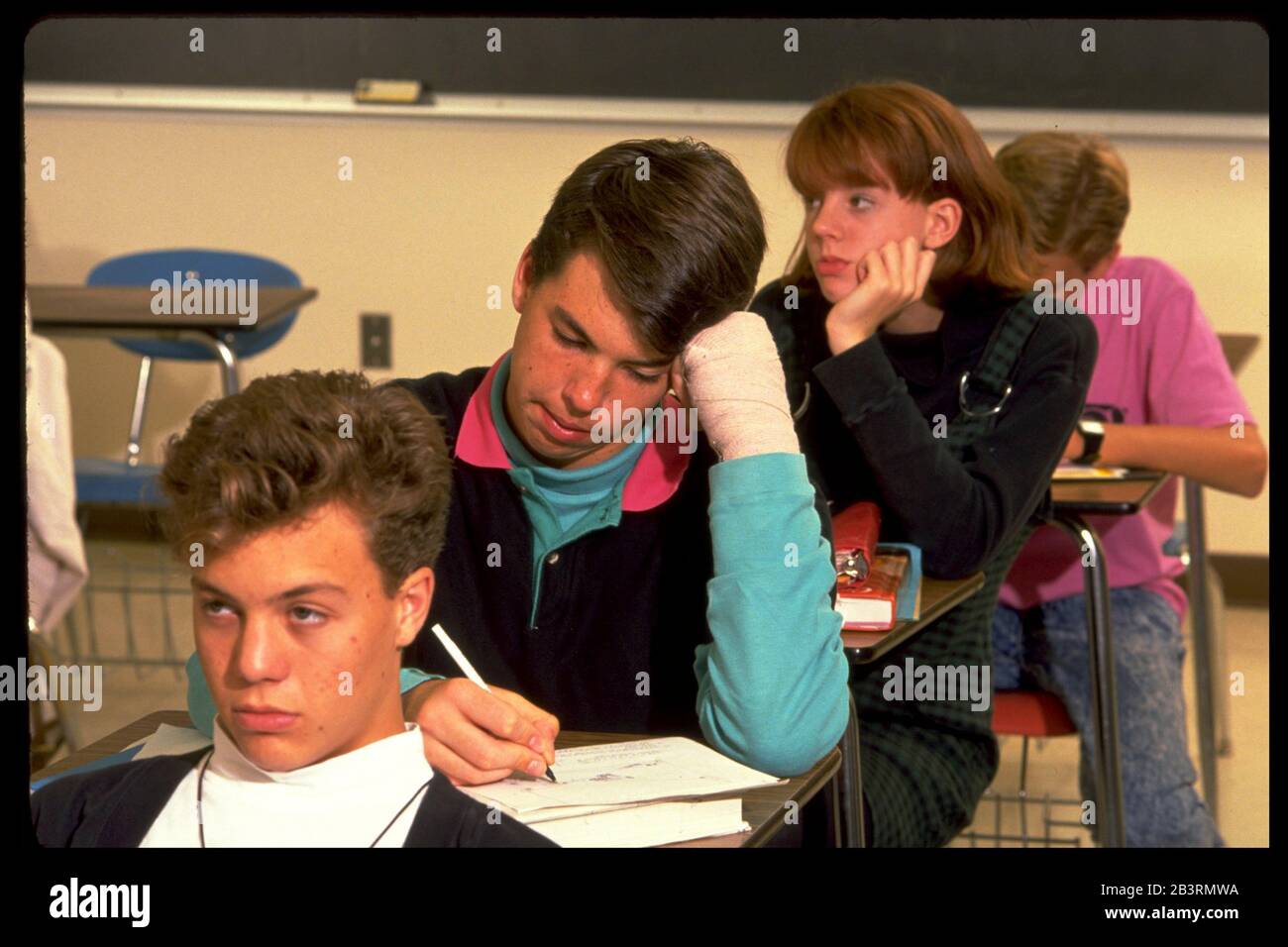 Austin Texas USA, circa 1993: Male student taking notes in high school ...