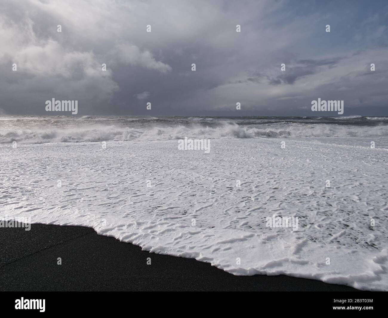 The black sandy beach at the Icelandic coast after a thunderstorm Stock Photo