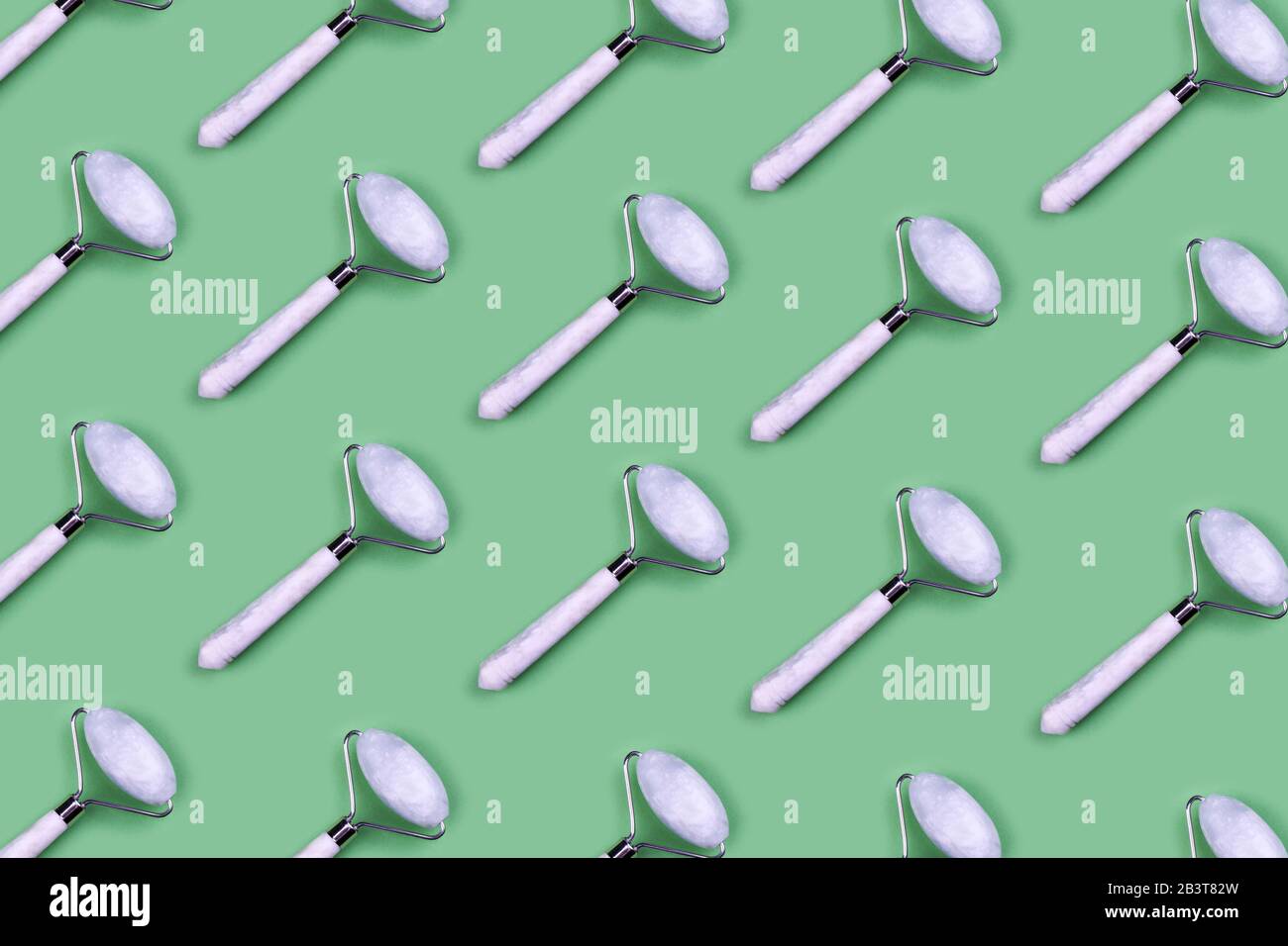 Download Green Jade Roller Tools For Facial Acupuncture Massage Pattern On Light Green Background Stock Photo Alamy PSD Mockup Templates