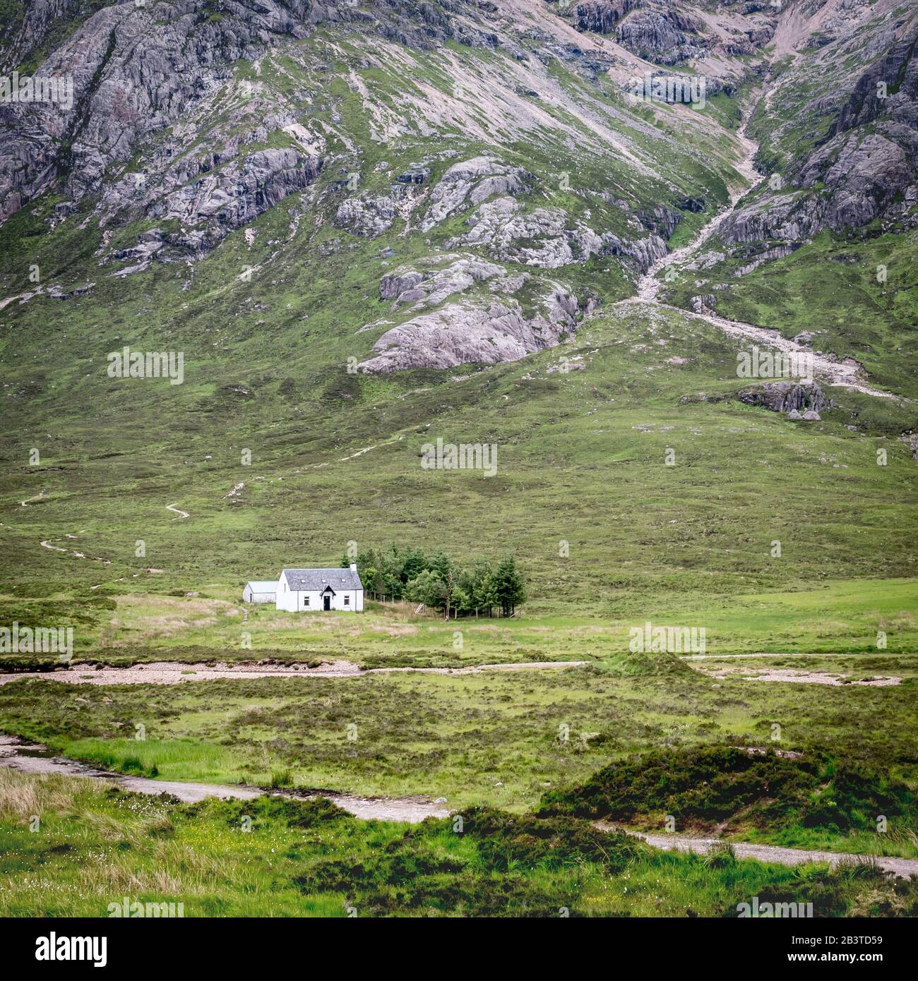 Scottish crofters cottage. The rugged landscape of the Grampian Mountains with a crofters cottage providing scale in the Highlands of Scotland. Stock Photo