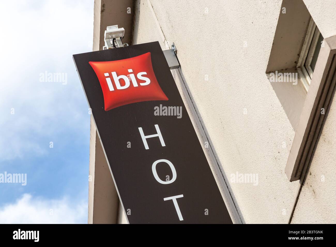 Cognac, France February 16, 2020 Ibis hotel sign on a pole. Ibis is an international hotel