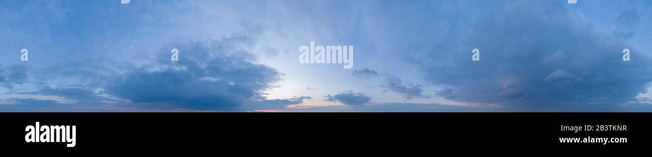 Large panorama of evening sunset sky with beautiful clouds Stock Photo ...