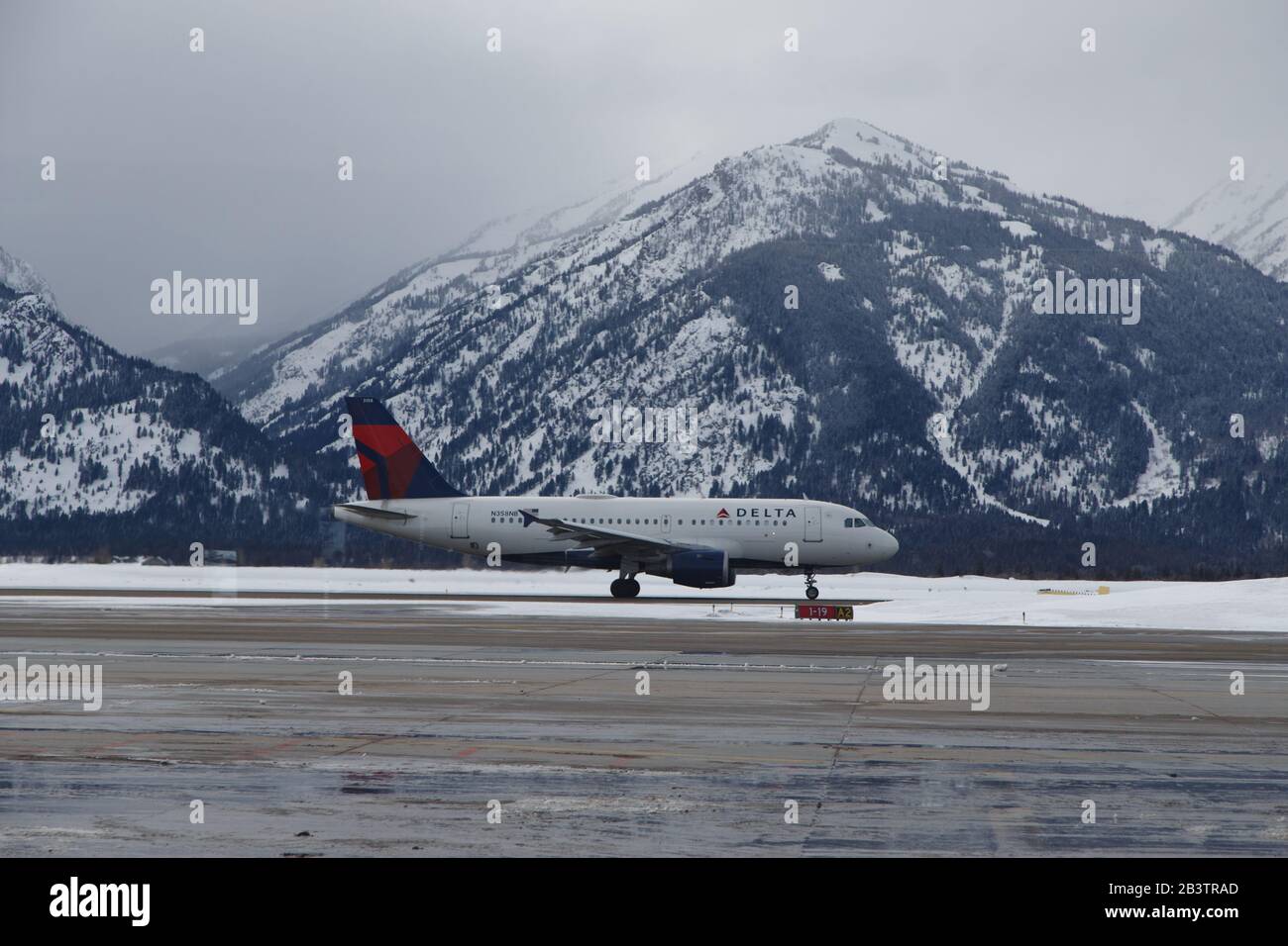 JACKSON, WY. - March 1, 2020. A Delta airlines flight lands at Jackson Hole airport. According to the International Air Transport Association, global Stock Photo