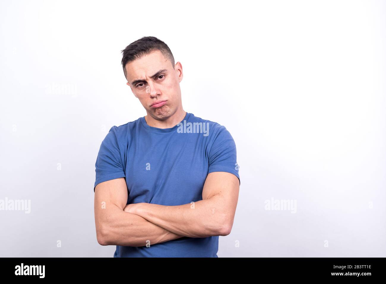 Bored man on white background, medium shot Stock Photo