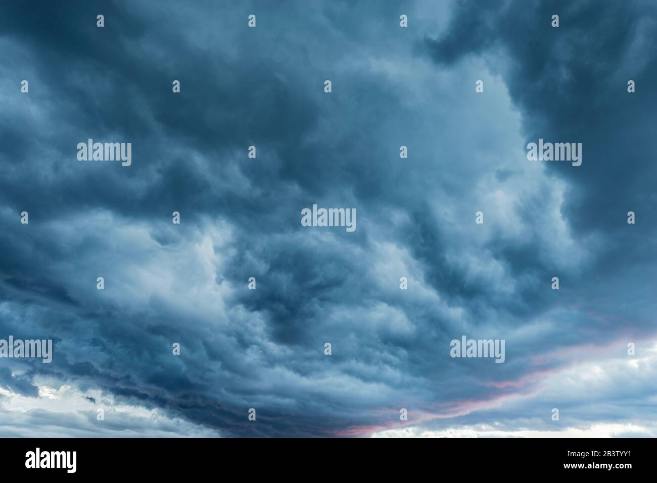 Amazing cloudscape on the sky at sunset time after rain Stock Photo - Alamy