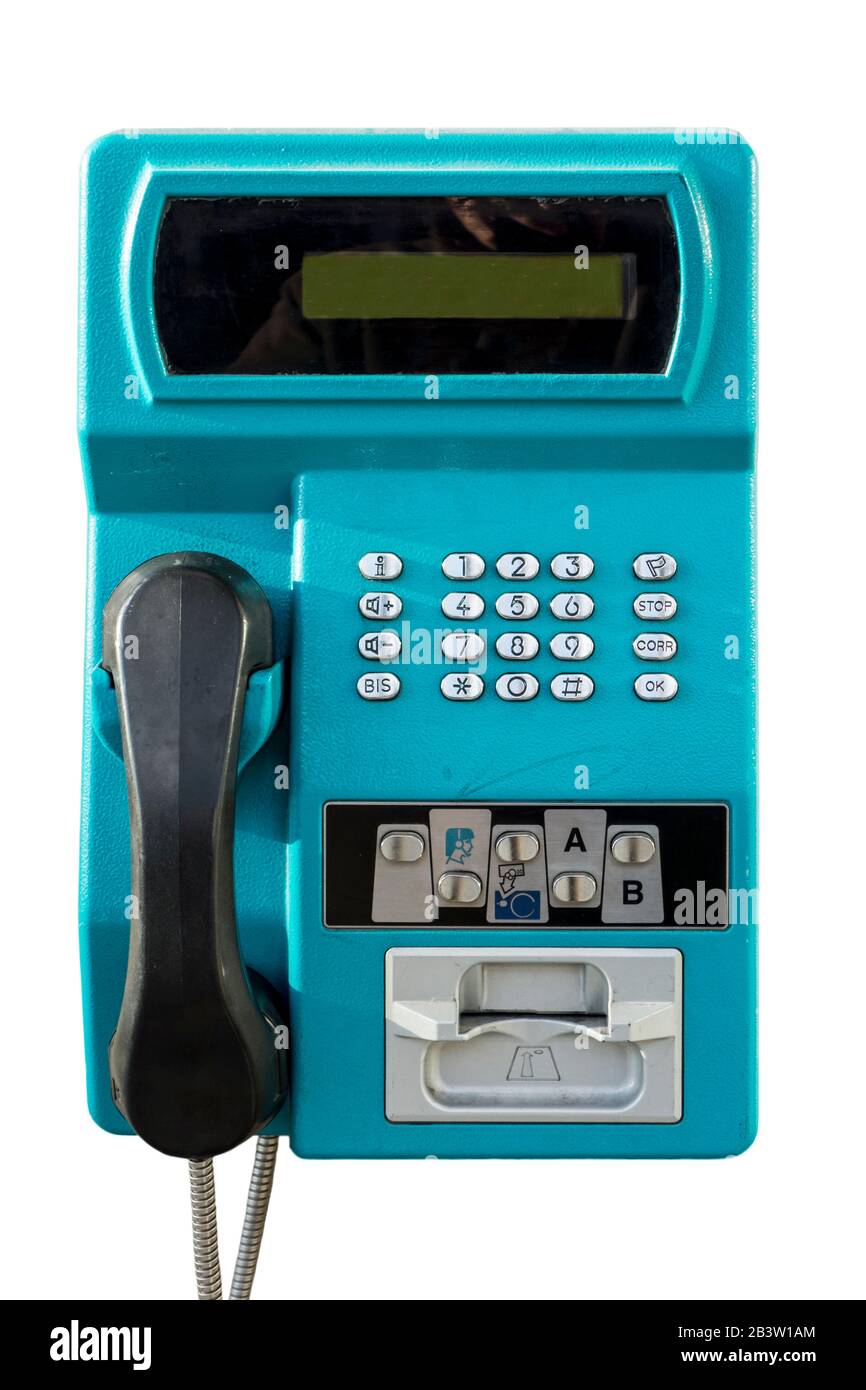 Old public payphone to be used with pre-payment card only in telephone booth from telecom provider against white background Stock Photo