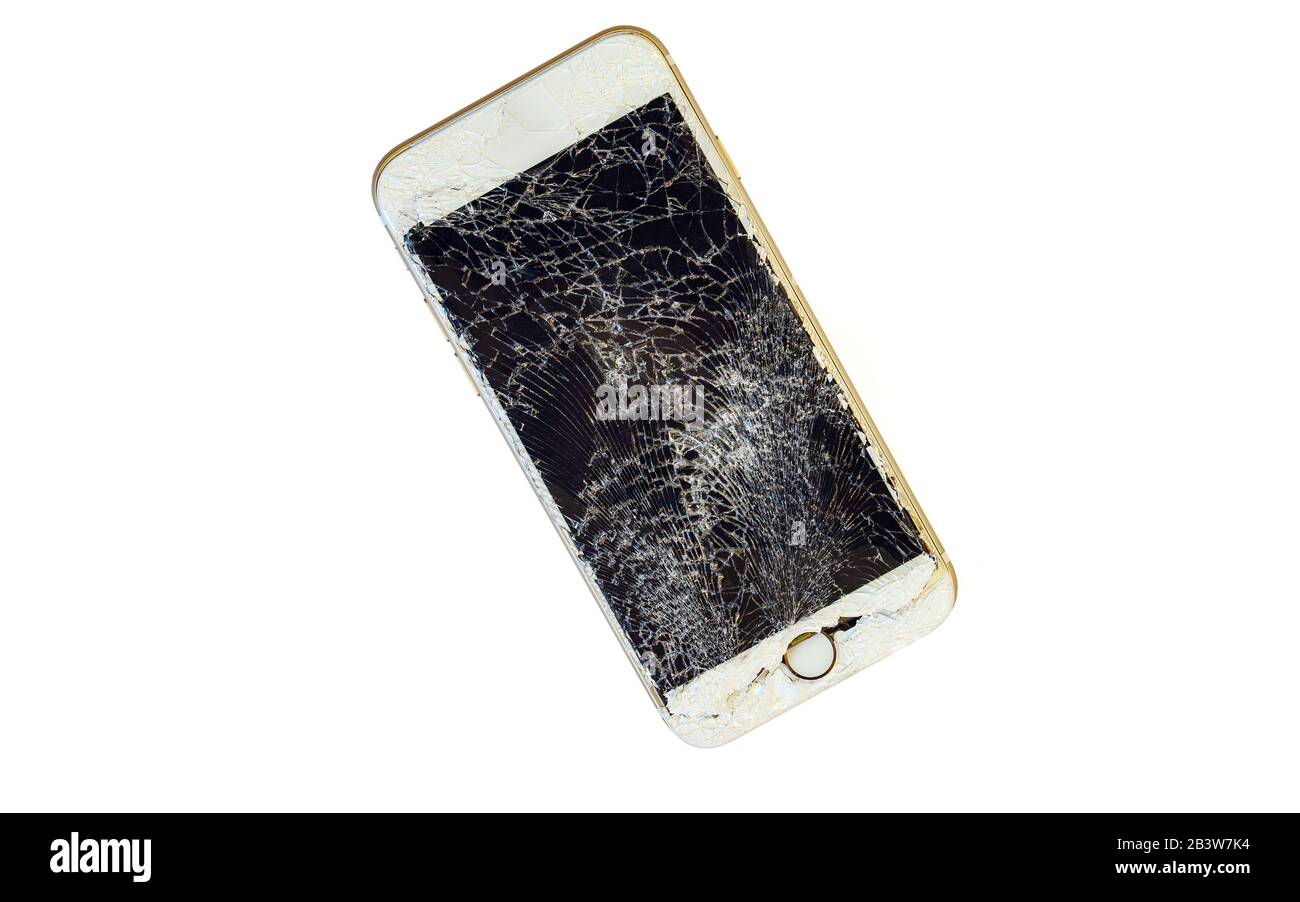 Modern smartphone with highly broken screen isolated on white background. Stock Photo