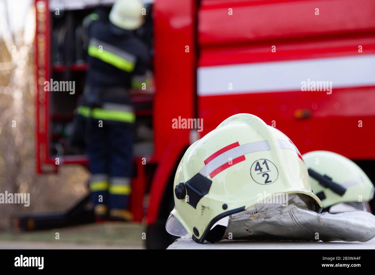 Fireman gear on fire truck. Firefighter helmet Stock Photo Alamy