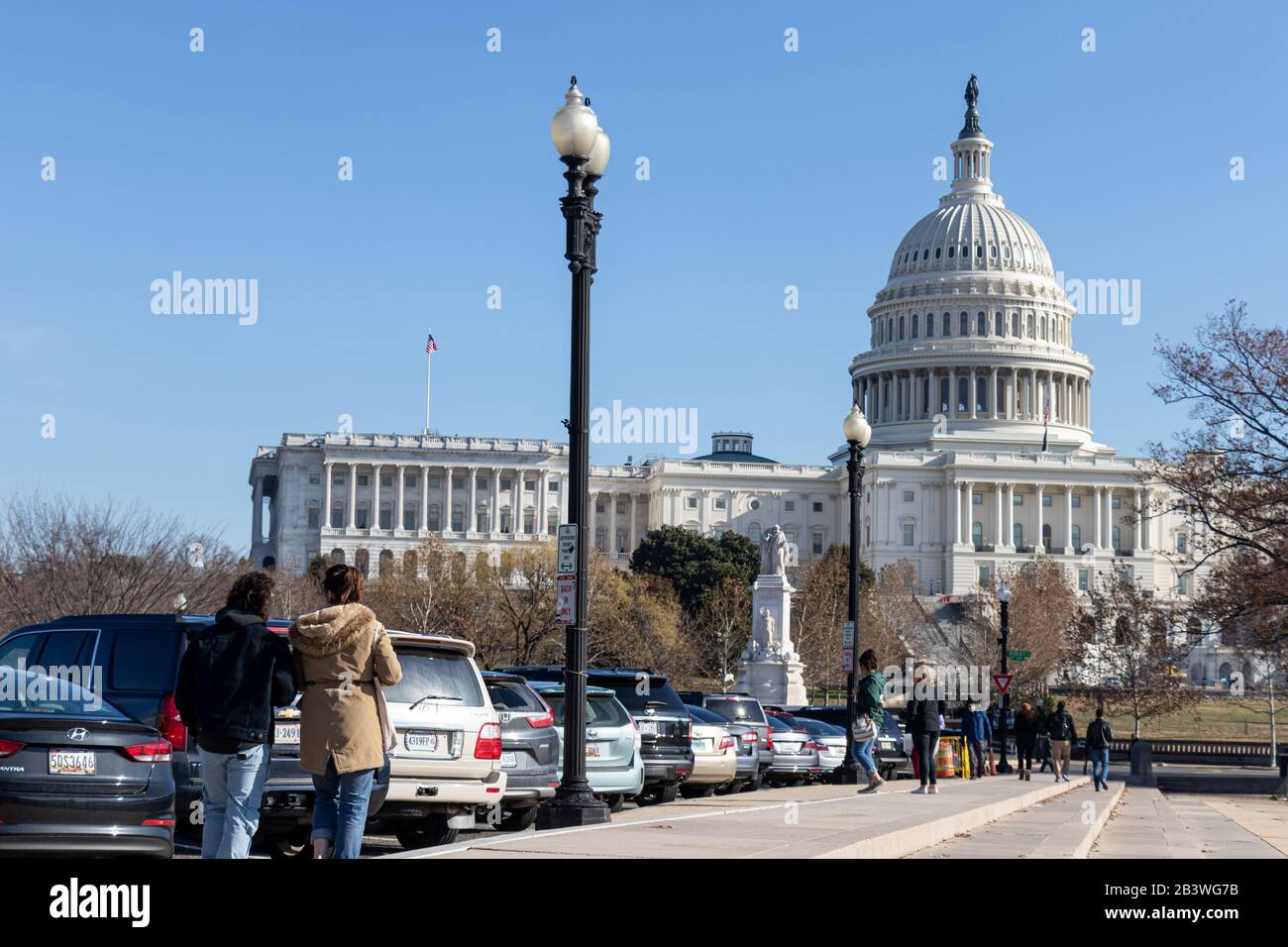 People walk Pennsylvania Avenue towards the US Capital Building on sunny day in Washington, D.C. Stock Photo