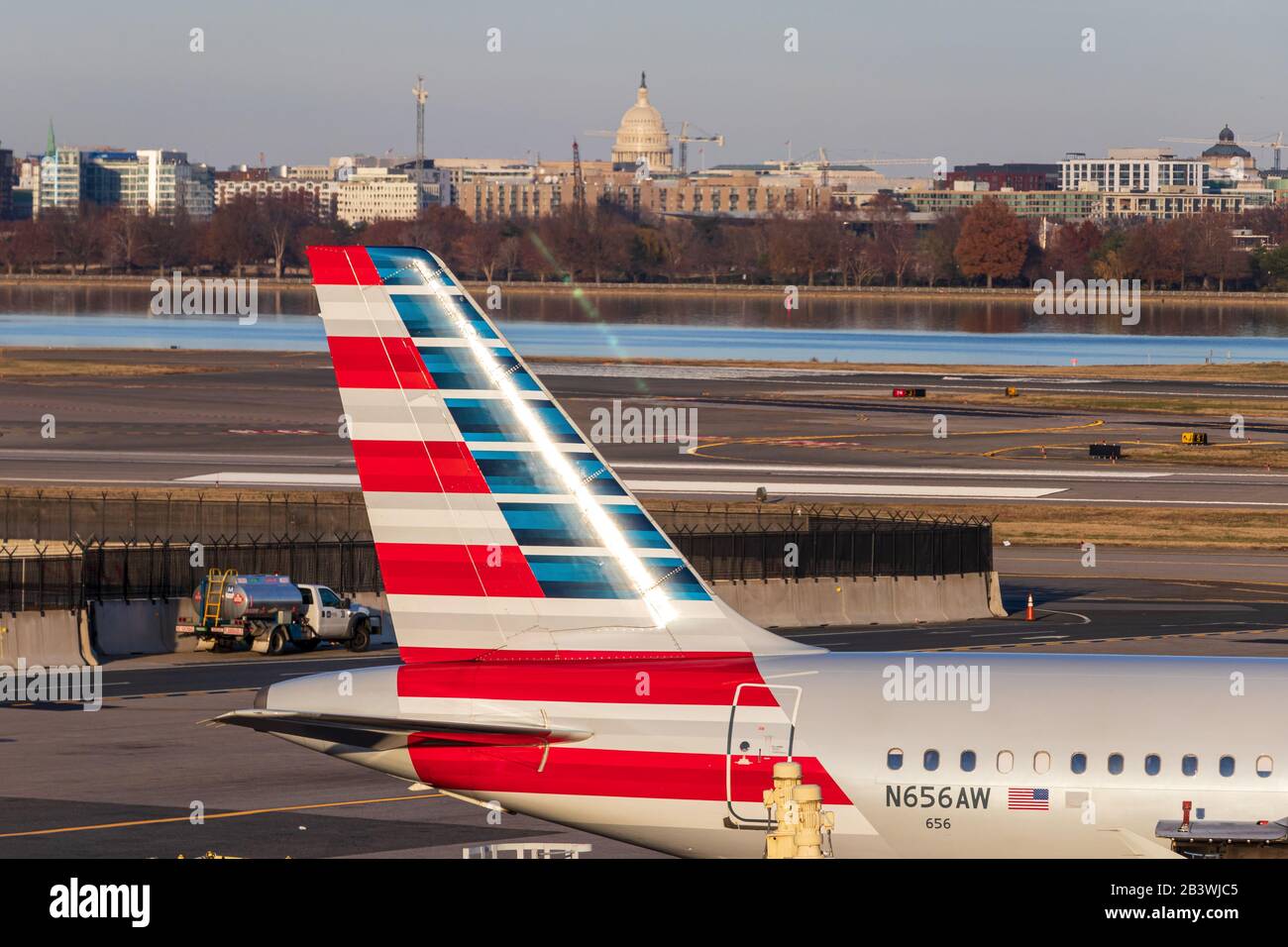 American Airlines tail fin at Reagan Washington National Airport, seen with the US Capital Building in-behind. Stock Photo