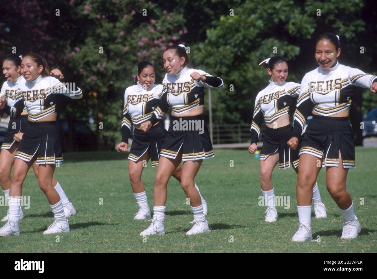 San Antonio, Texas Hispanic high school cheerleaders perform a routine