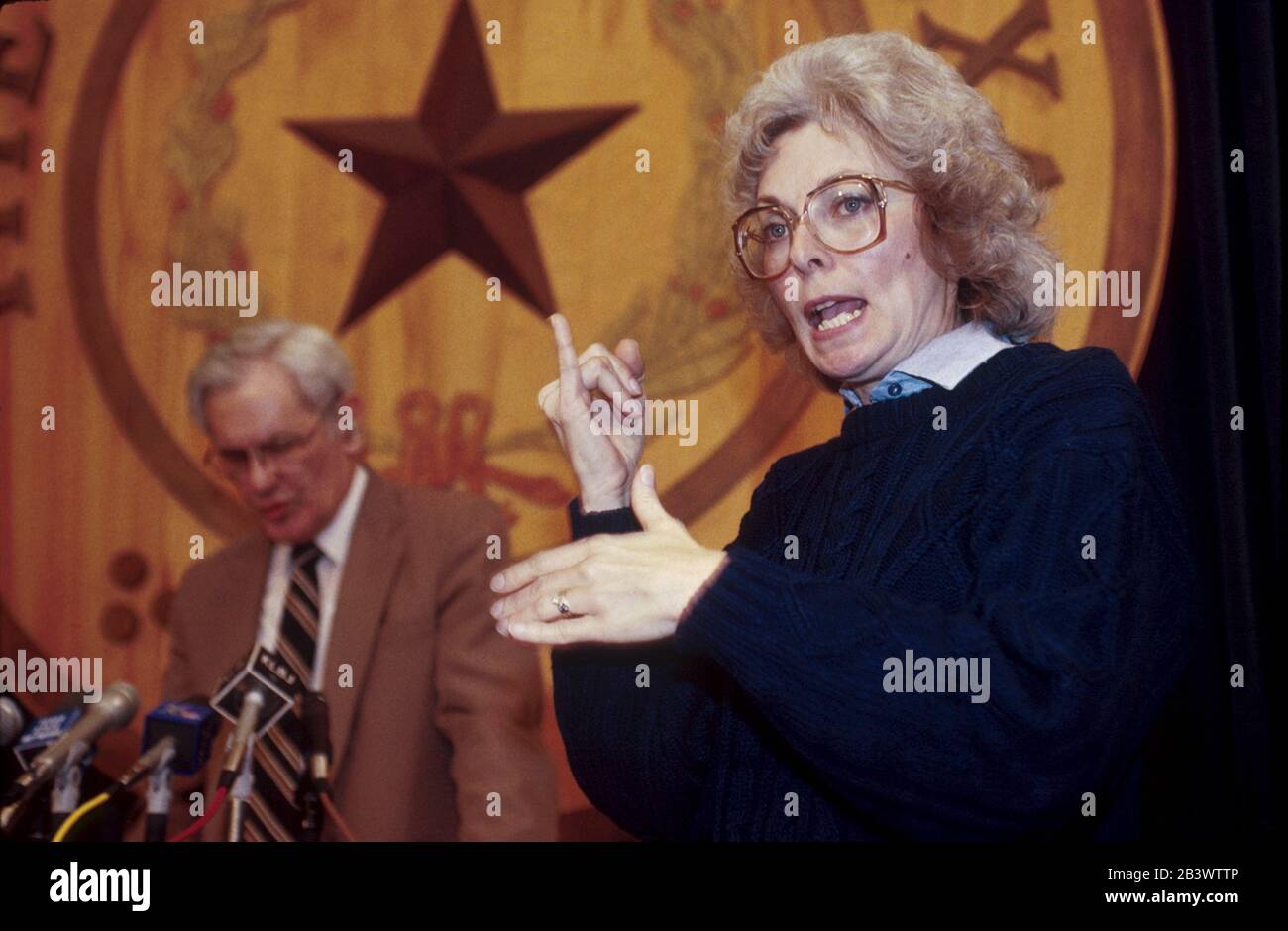 Austin, Texas USA: American Sign Language interpreter translates for the hearing impaired during a press conference at the Texas Capitol.  ©Bob Daemmrich Stock Photo