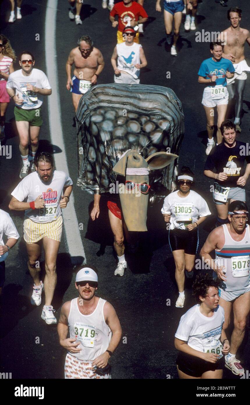Austin Texas USA: Runners in regular running gear surround runners costumed as an armadillo in the annual Capitol 10,000 footrace in and around downtown. ©Bob Daemmrich Stock Photo