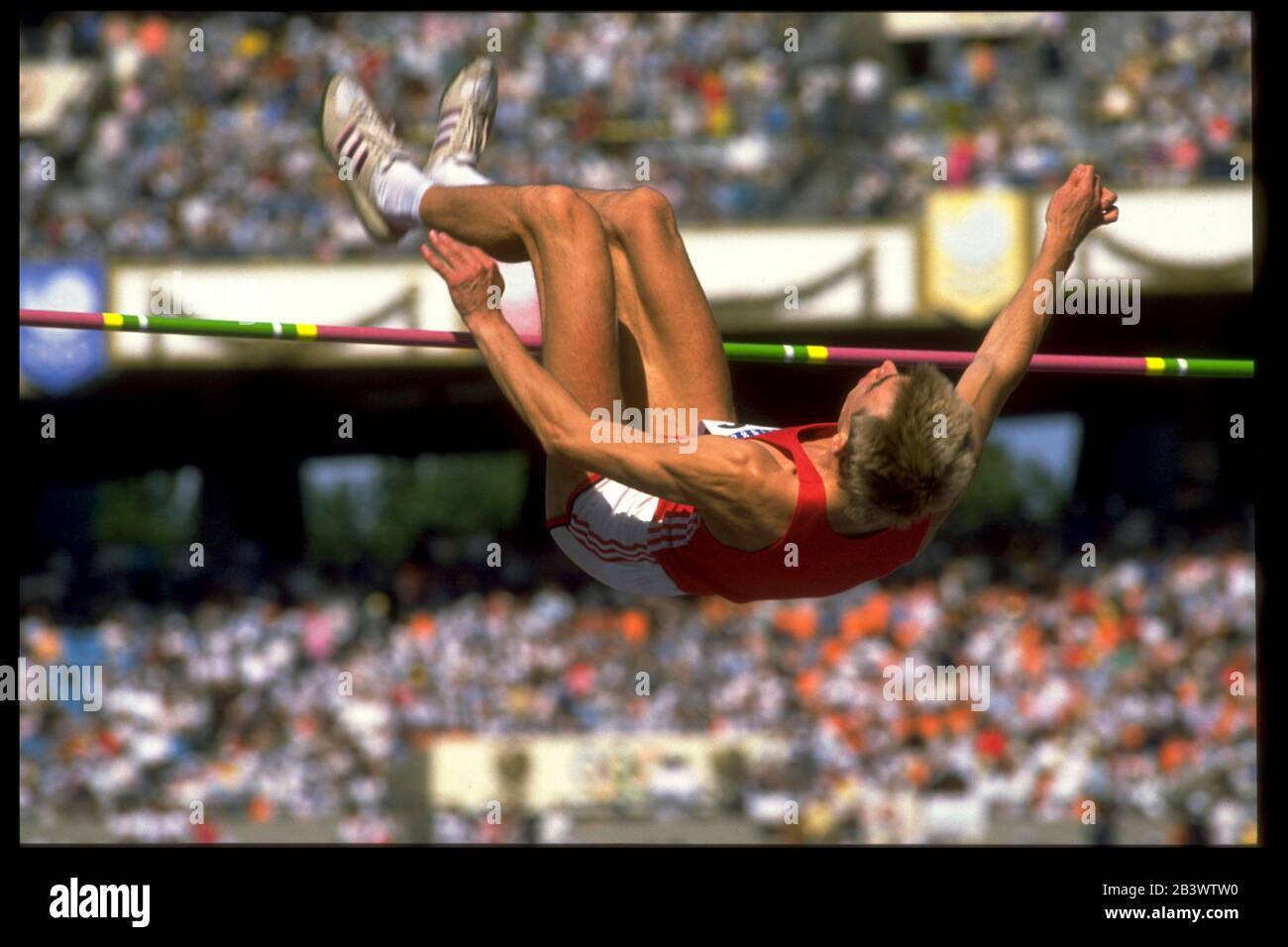 Seoul, Korea 1988: Male high jumper clears bar during competition at the 1988 Olympic Games. ©Bob Daemmrich Stock Photo