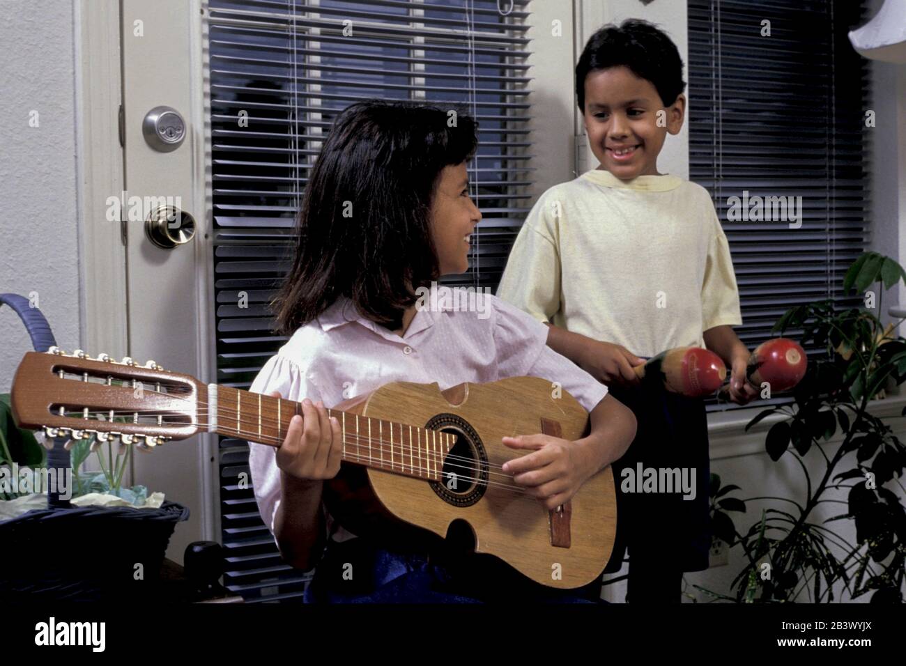Austin Texas USA,1989 Hispanic children playing traditional Puerto