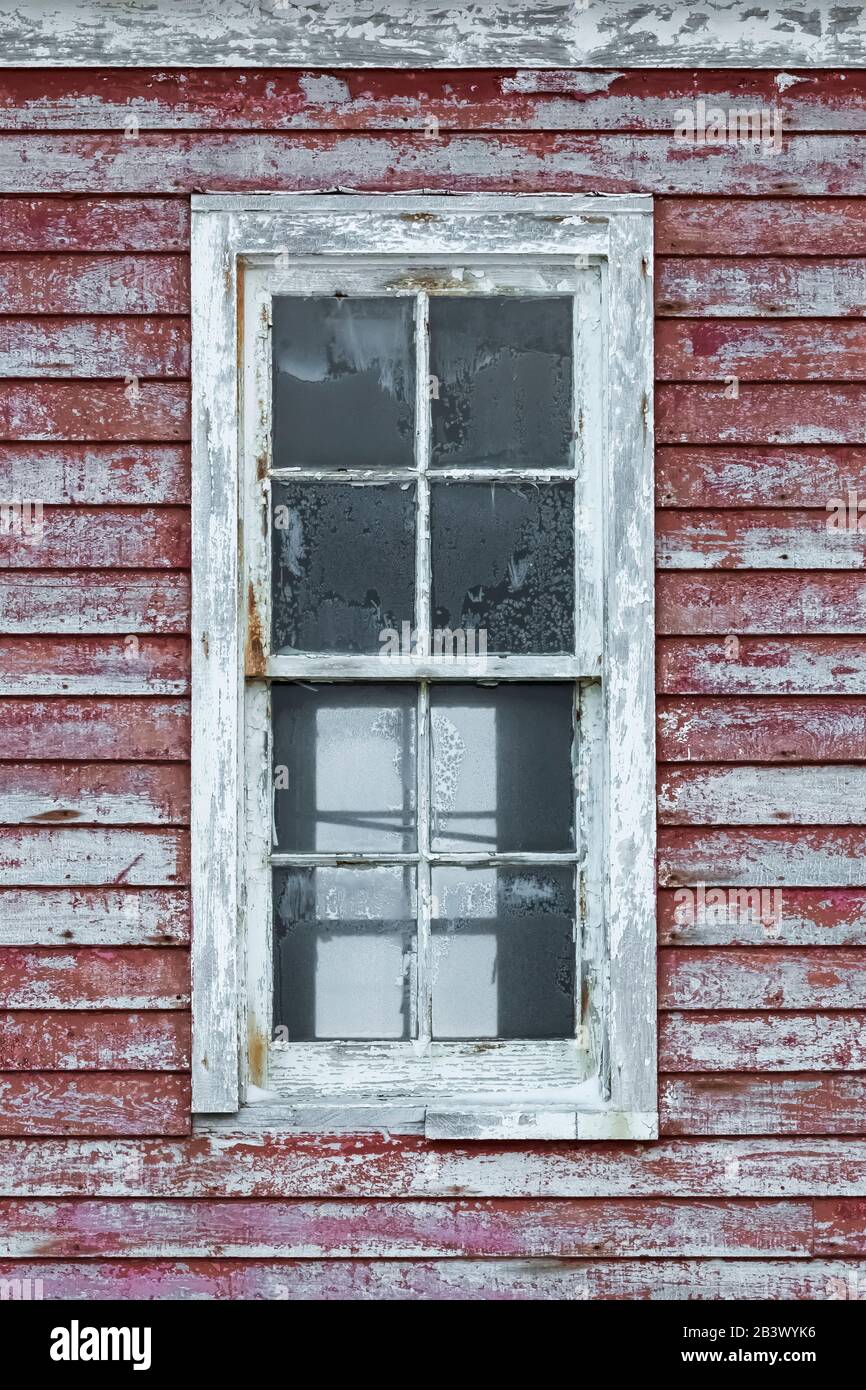 Window on a historic government structure at Cape Race on the Avalon Peninsula, Newfoundland, Canada Stock Photo