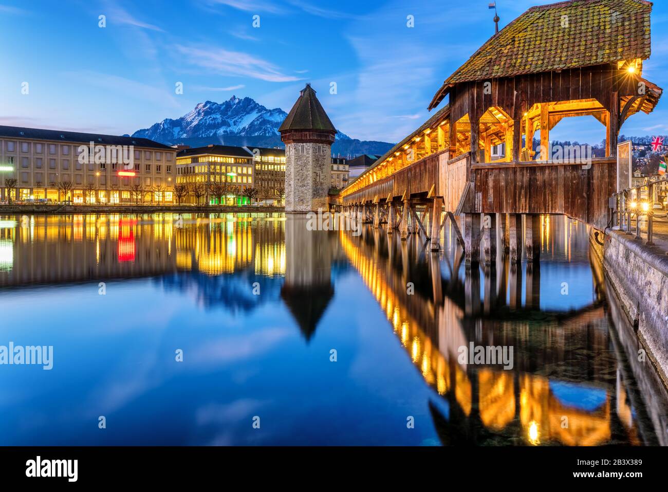 Historical Lucerne Old town in Alps mountains, Switzerland. with wooden Chapel bridge, the Water tower, the Reuss river and Mount Pilatus Stock Photo