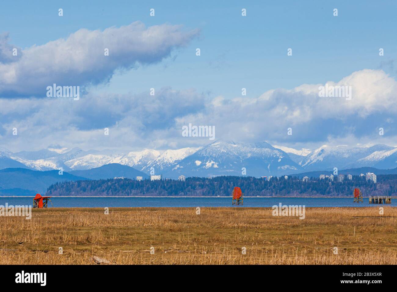 View of Point Grey with the buildings of the University of British Columbia against the North Shore Mountains of Vancouver Stock Photo