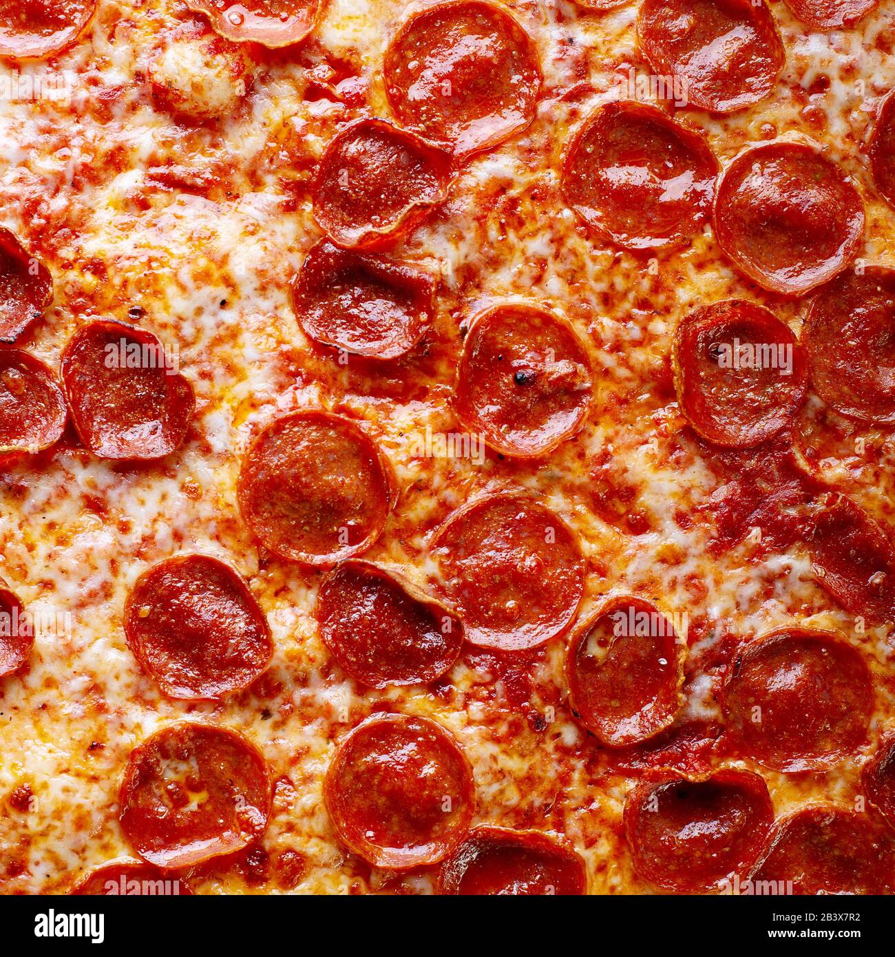 Pepperoni pizza surface close up food background Stock Photo Alamy