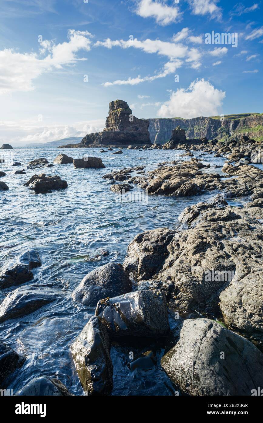 Rugged coastline of Talisker Bay on the Isle of Skye on a sunny afternoon, Scotland Stock Photo