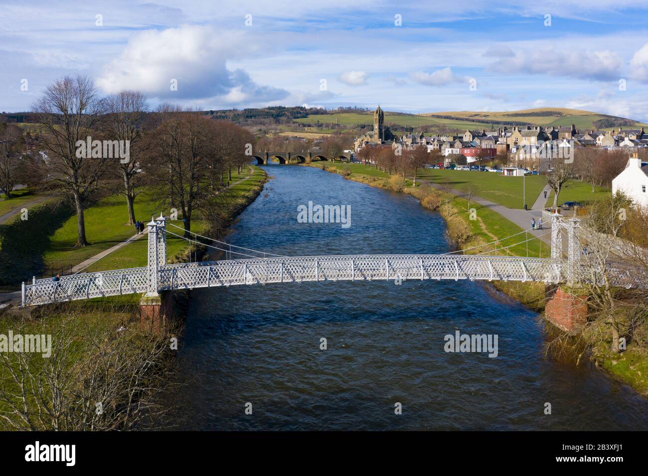 View of suspension bridge crossing River Tweed in town of Peebles in the Scottish Borders, Scotland,UK Stock Photo