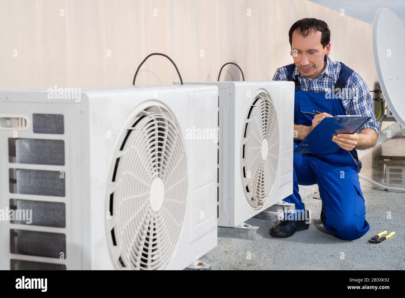 Man Doing Heating, Ventilation, And Air Conditioning Inspection Stock