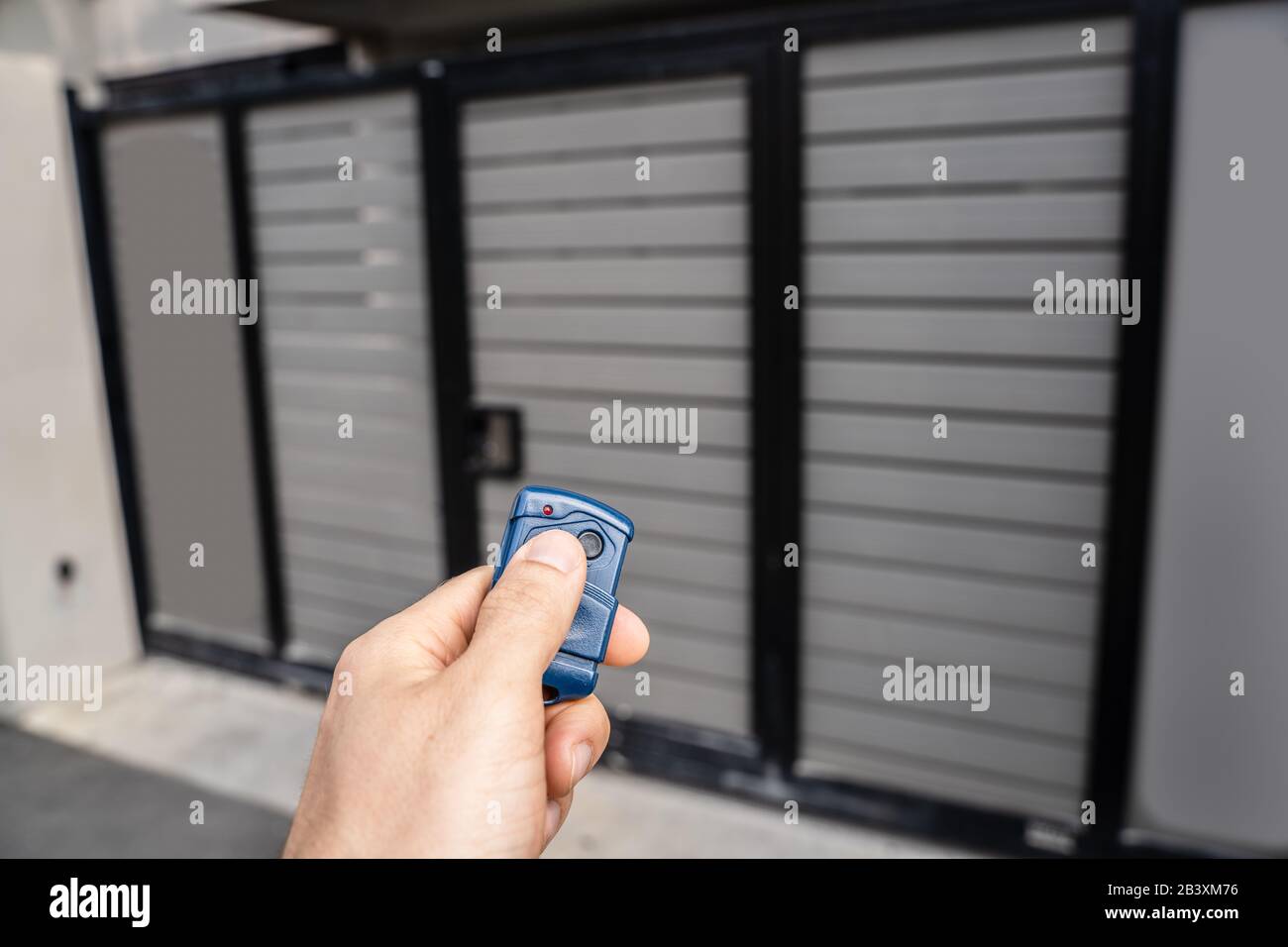 Using Remote Control To Open Electric Gate Stock Photo