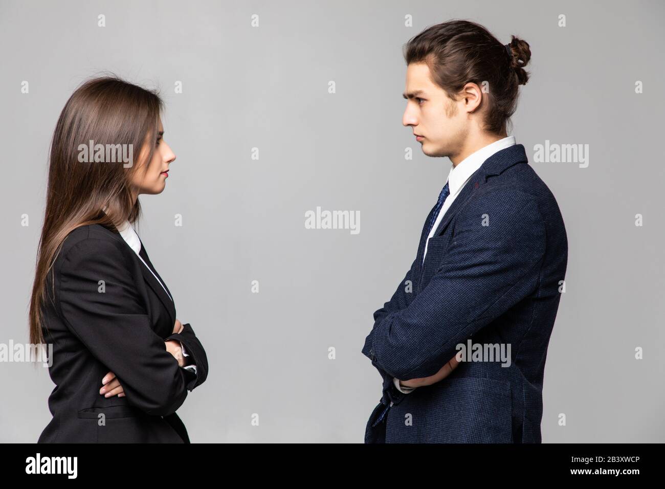 Confront Definition Concept of confrontation in business. Close up photo of two young ...