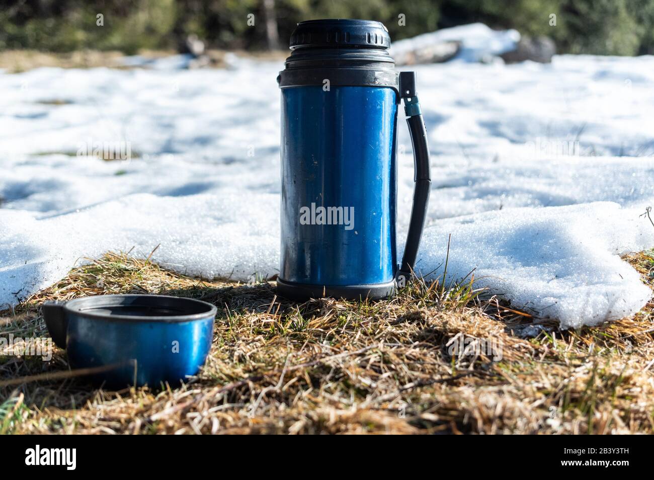 Thermos camping. Thermos for tourism. Thermos in nature Stock