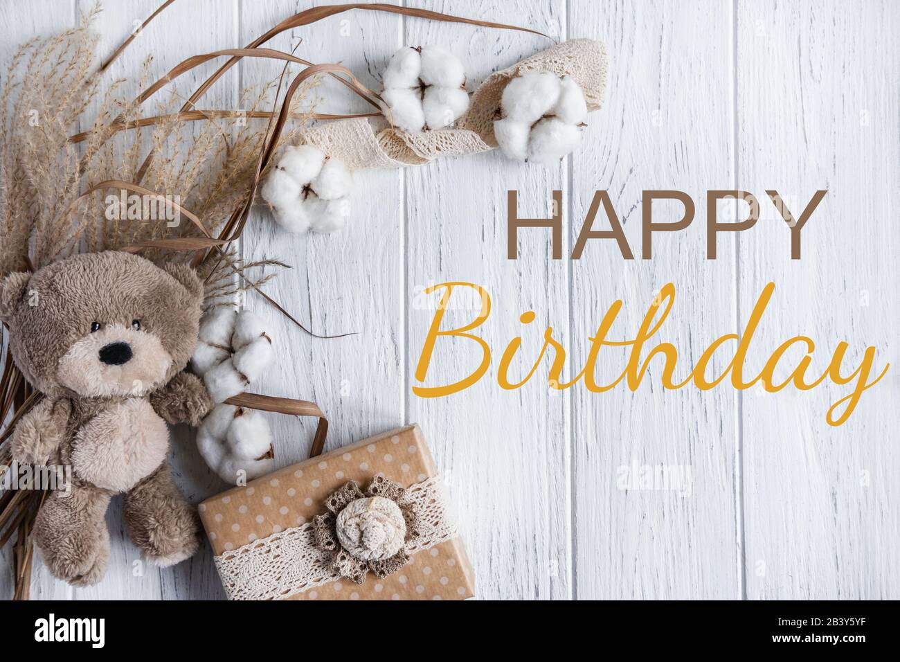 Happy Birthday to You. Greeting card with gift box on a white wooden