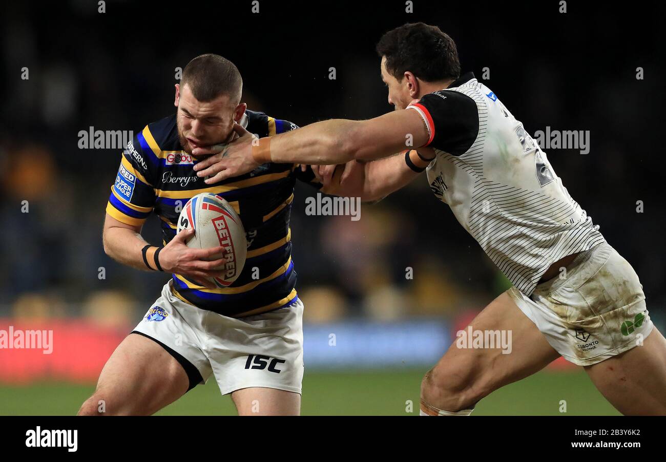 Leeds Rhinos' Cameron Smith is tackled by Toronto Wolfpack's Sonny Bill Williams during the Betfred Super League match at Emerald Headingley Stadium, Leeds. Stock Photo