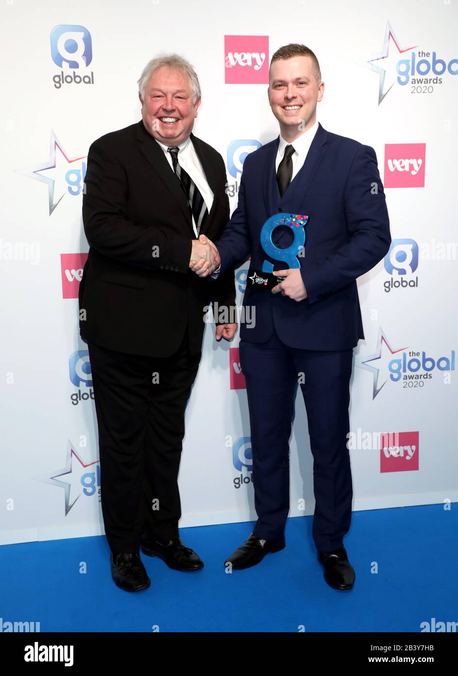 Nick Ferrari (left) with Stuart Outten winner of The LBC Award Britain's Bravest Police Officer at The Global Awards 2020 with Very.co.uk at London's Eventim Apollo Hammersmith. Stock Photo