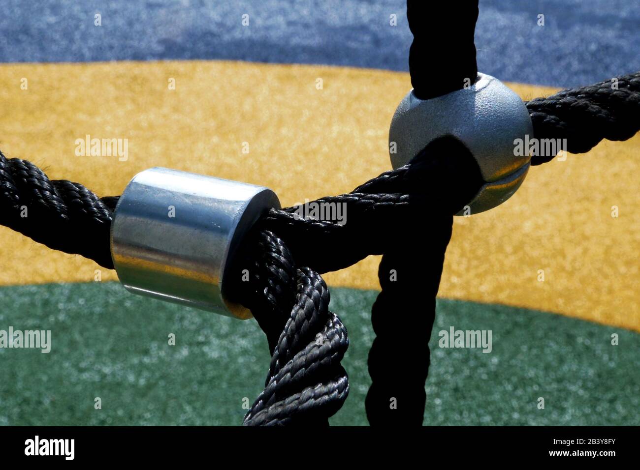climbing equipment in playground. public park. black vinyl ropes