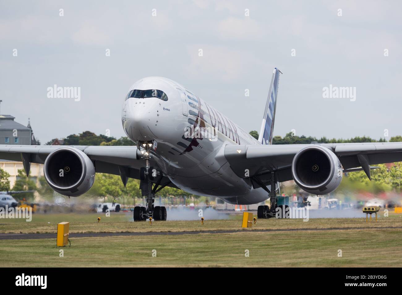 Farnborough, UK - July 15, 2014: Airbus flies the A350 XWB at the Farnborough Int'l Airshow, in the colors of Qatar Airways as launching customer for Stock Photo