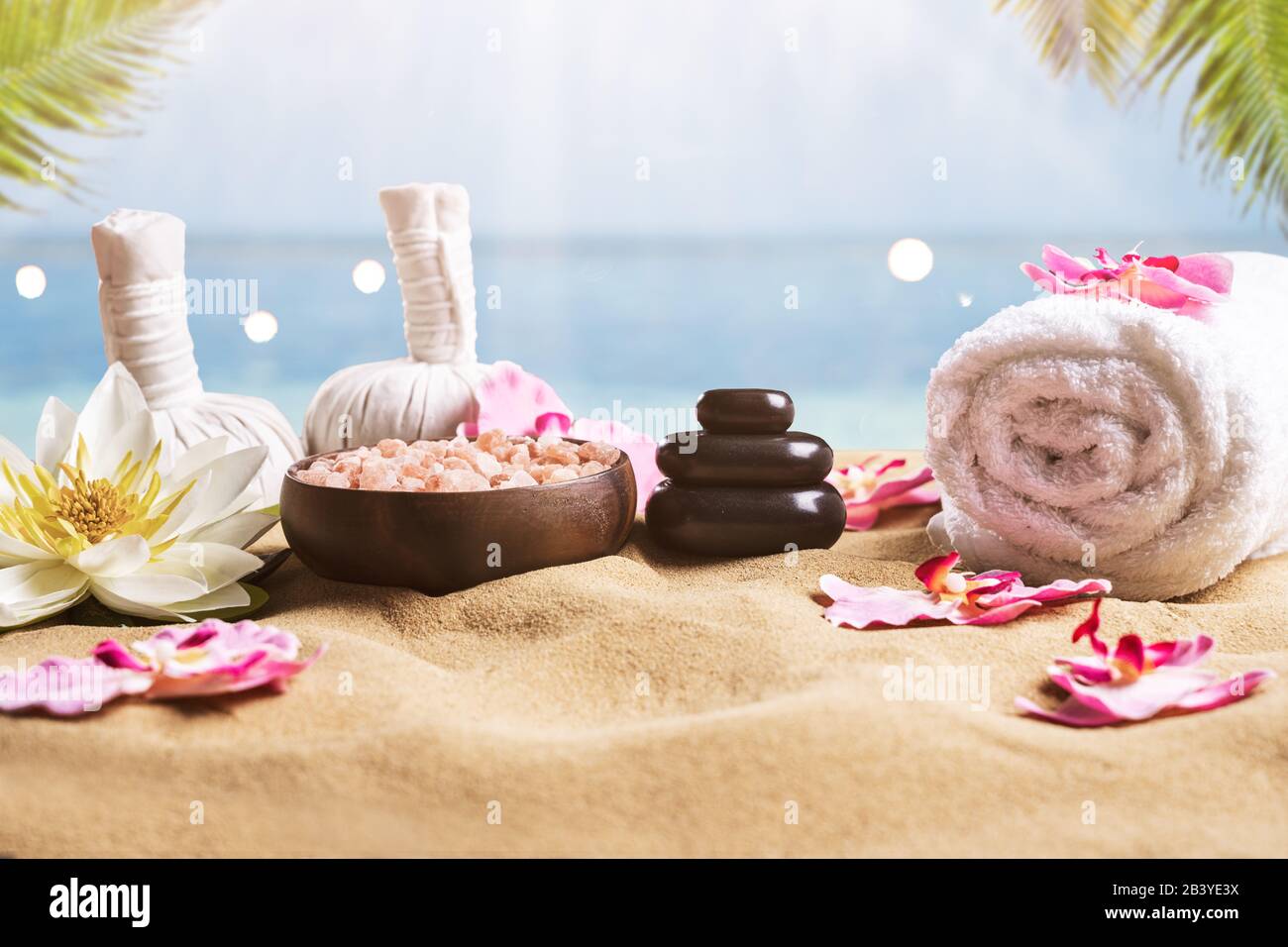 Massage And Spa Accessories On Sandy Beach Stock Photo