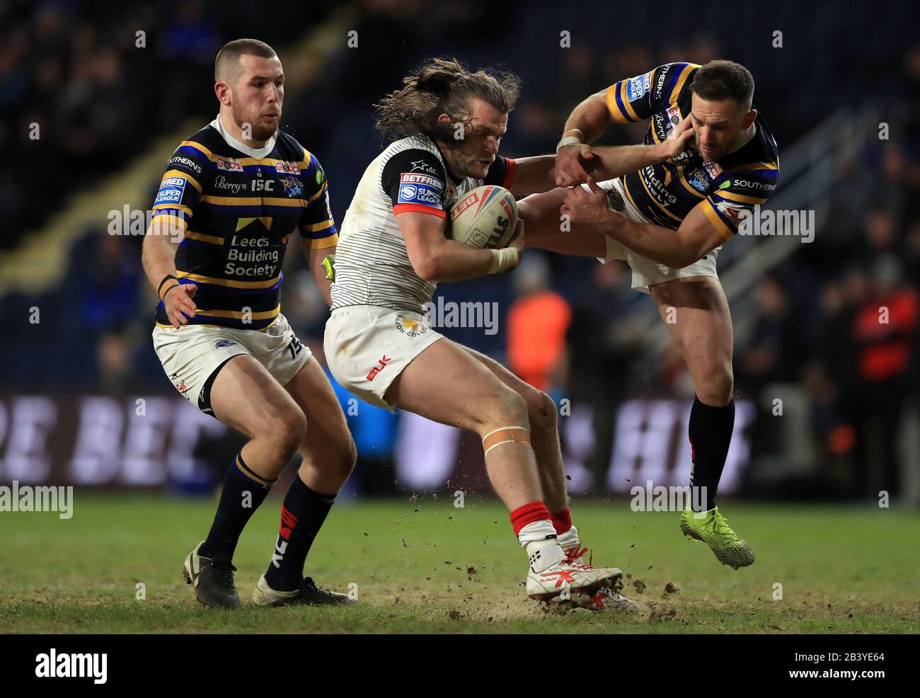 Leeds Rhinos' Luke Gale is handed off by Toronto Wolfpack's Liam Kay during the Betfred Super League match at Emerald Headingley Stadium, Leeds. Stock Photo