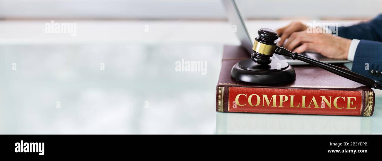 Judge Gavel And Soundboard On Compliance Law Book Stock Photo