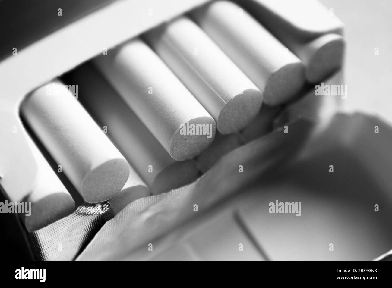 Close up row of cigarettes inside a pack. Stock Photo