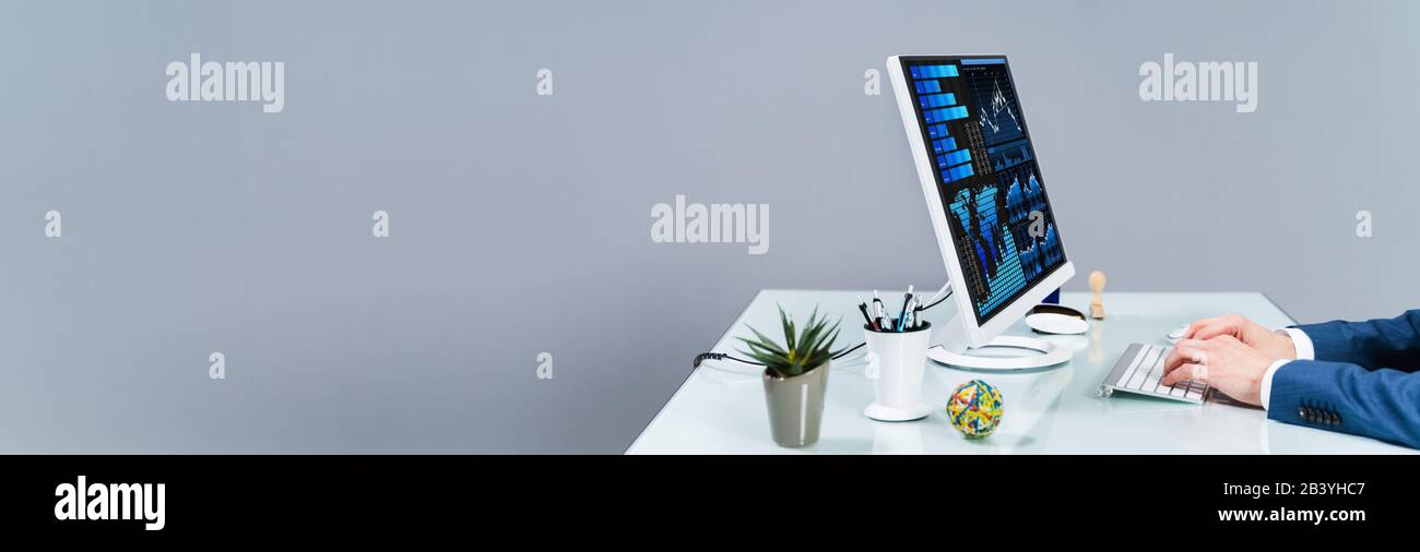 Business Analyst Man Working On Computer In The Office Stock Photo