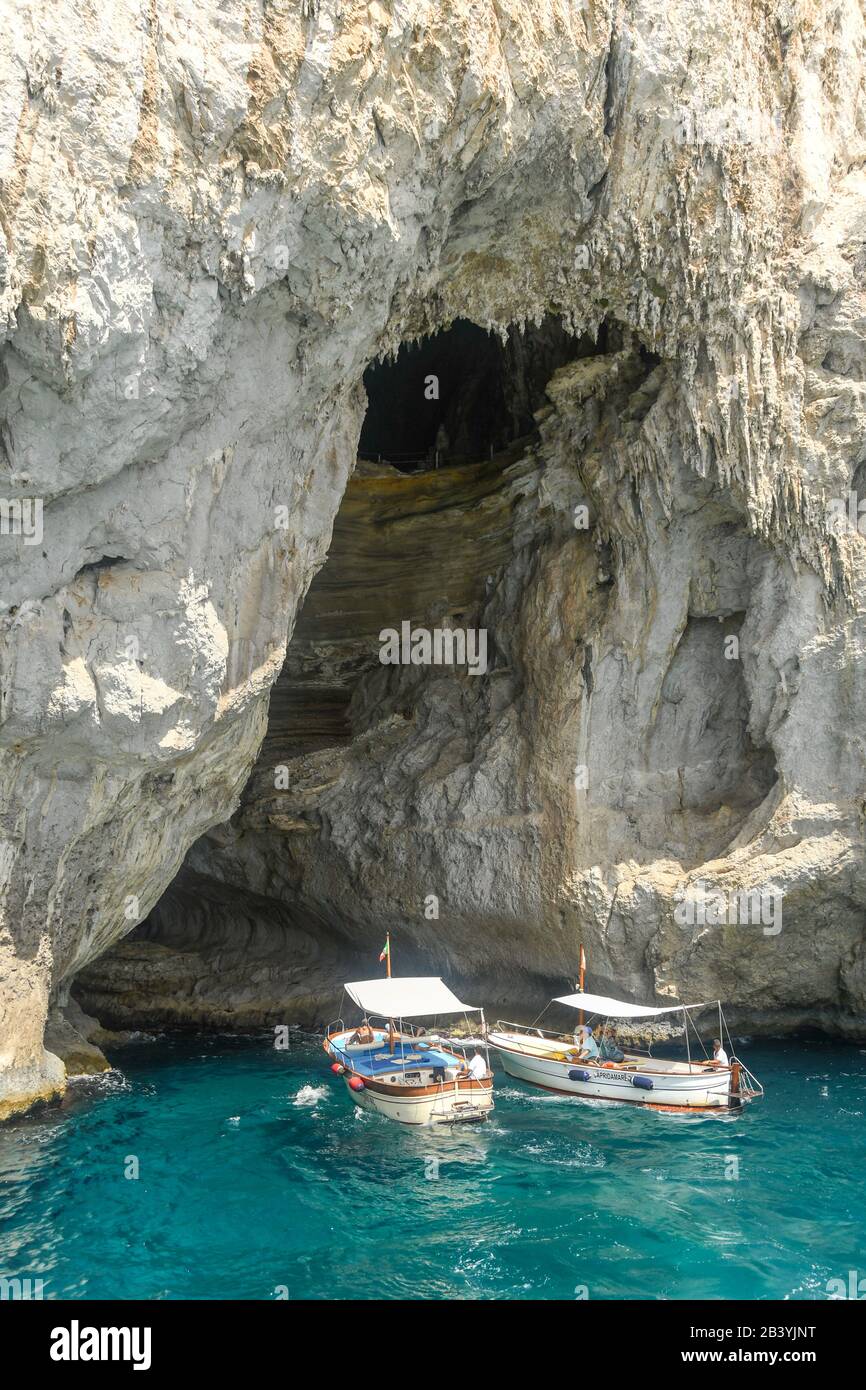 ISLE OF CAPRI, ITALY - AUGUST 2019: Small boats at the entrance to the  "Grotta Bianca" or "White Cave" on the Isle of Capri Stock Photo - Alamy