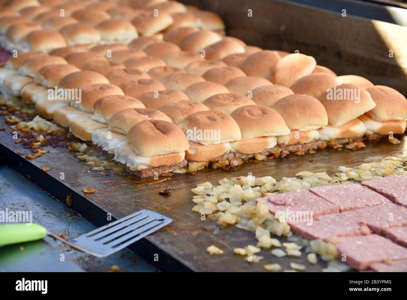 Grilled vegan, plant-based protein (fake meat) 'beef' Impossible Burgers for White Castle sliders sampled by attendees at CES, Las Vegas, NV, USA Stock Photo